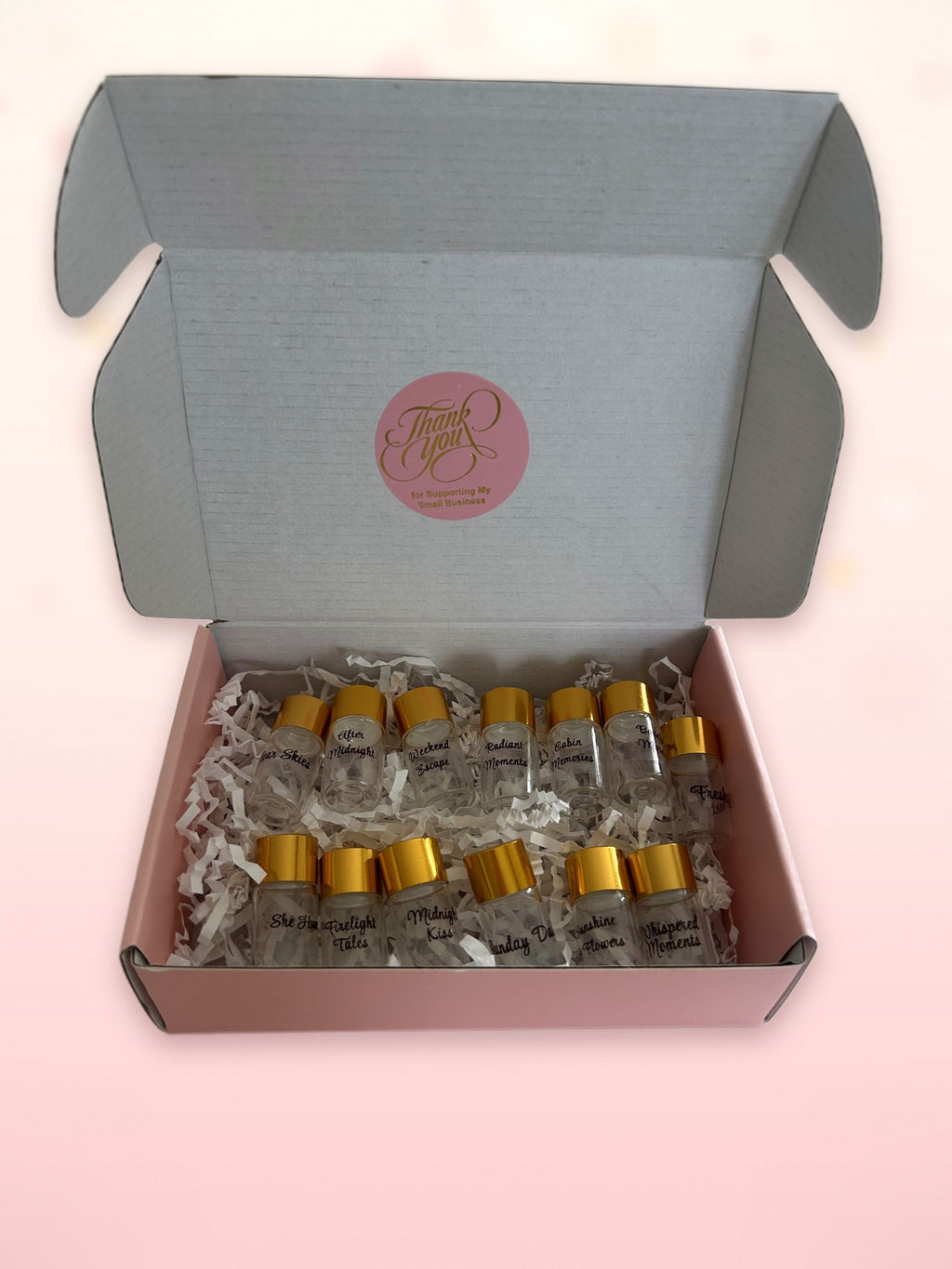 A selection of Nostaira fragrance sample vials in the presentation box
